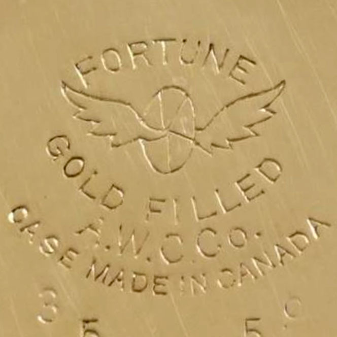 Watch Case Marking Variant for American Watch Case Co. of Toronto, Ltd. Fortune: Fortune
Gold Filled
A.W.C.Co.
Case Made in Canada
[Wheel with Two Wings]
