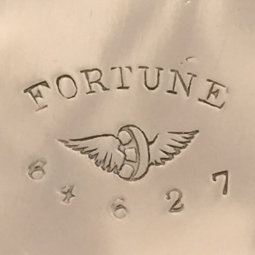 Watch Case Marking Variant for American Watch Case Co. of Toronto, Ltd. Fortune: Fortune
[Wheel with Two Wings]