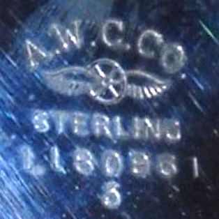 Watch Case Marking Variant for American Watch Case Co. of Toronto, Ltd. AWCCo Sterling: A.W.C.Co.
[Winged Wheel with Wings]
Sterling