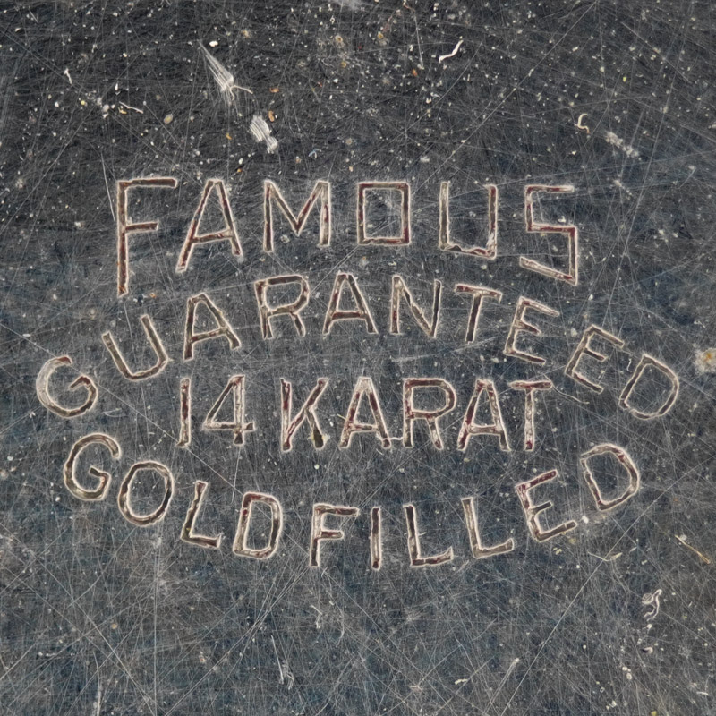 Watch Case Marking for Illinois Watch Case Co. Famous: Famous Guaranteed 14 Karat Gold Filled
