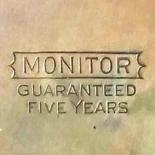 Watch Case Marking Variant for Illinois Watch Case Co. Monitor: Monitor
[In Outline Banner] 
Guaranteed 
Five Years