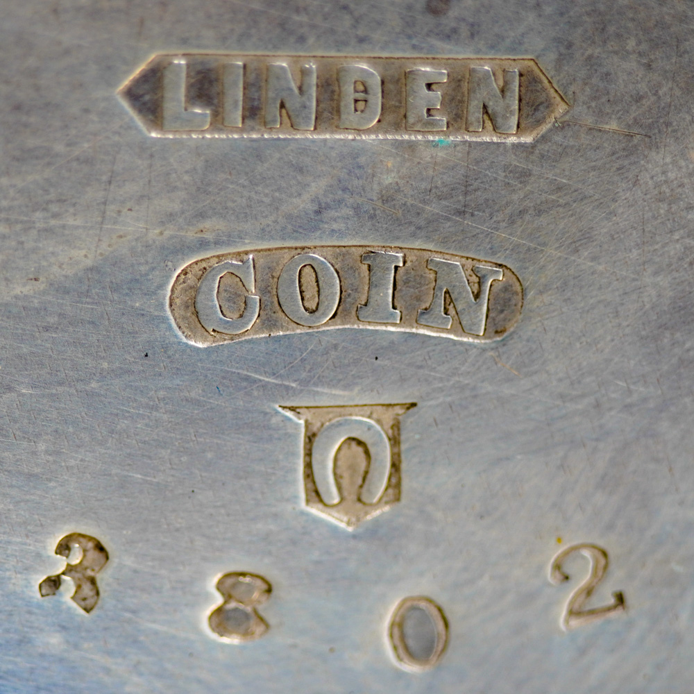Watch Case Marking for Linden Watch Case Co. Linden Coin: Linden [in Pointed Banner]
Coin [Embossed in Bean Shape]
[Horseshoe inside Embossed Shield]