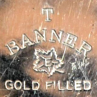 Watch Case Marking Variant for P.W. Ellis & Co. Ltd. Banner: T
Banner
E
[Maple Leaf]
Gold Filled