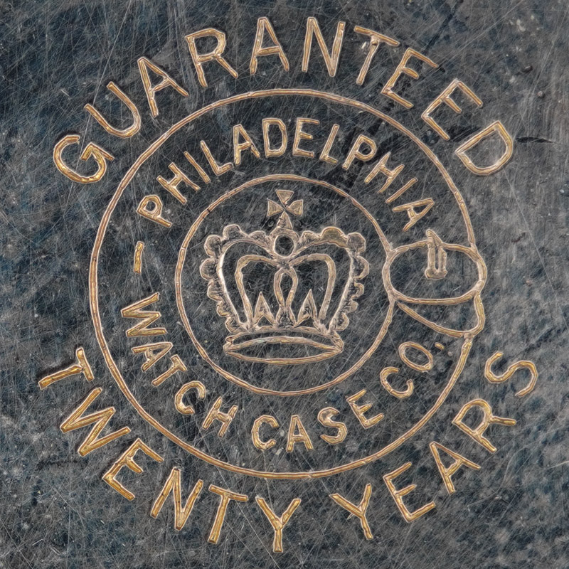 Watch Case Marking for Philadelphia Watch Case Co. Crown 10K/20YR: Guaranteed
Twenty Years
Philadelphia
Watch Case Co.
[Crown with Cross]
[Buckle]