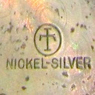 Watch Case Marking for Illinois Watch Case Co. Tenton Label Nickel Silver: T [IT Cross]
Nickel-Silver
